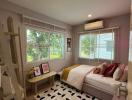 Cozy bedroom with ample natural light and modern decor