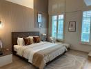 Spacious bedroom with a large bed and elegant interior design