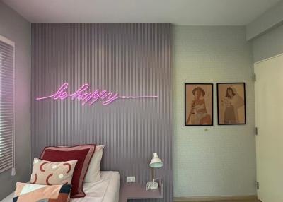 Cozy bedroom with modern design and neon sign
