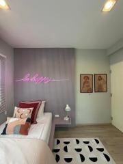 Cozy bedroom with modern design and neon sign