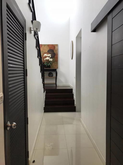 Modern hallway with stairs and decorative elements