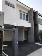 Modern two-story house with a covered parking space