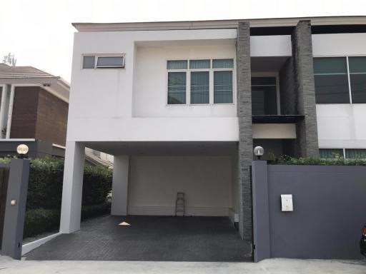 Modern two-story house with covered parking space