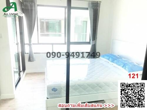 Brightly lit bedroom with large windows and a double bed