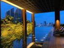 Luxurious building rooftop terrace with infinity pool and city skyline view at dusk