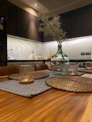 Modern kitchen with dark wood tones and upscale finishes