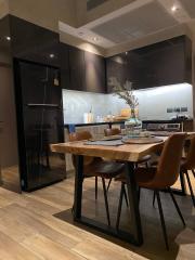 Modern kitchen with wooden table and designer chairs