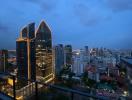 Evening cityscape view from a high-rise balcony