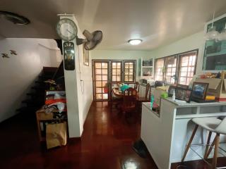 Spacious living room with hardwood floors and natural lighting