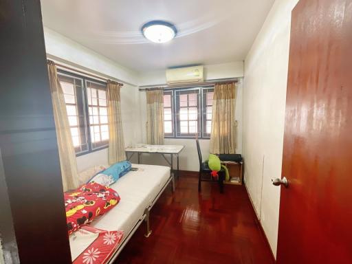 Cozy bedroom with natural light and air conditioning