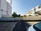 View of an outdoor parking space adjacent to residential buildings