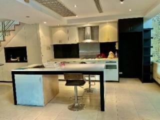 Modern kitchen with central island and stainless steel appliances