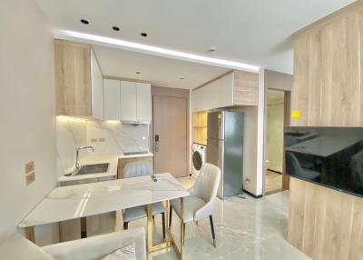 Modern kitchen with integrated appliances and marble countertops