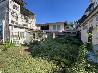 Suburban home exterior with overgrown garden