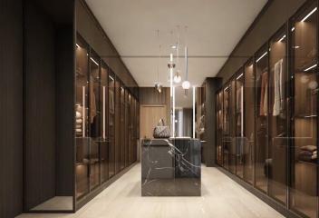 Modern and luxurious walk-in closet with ample storage and elegant design