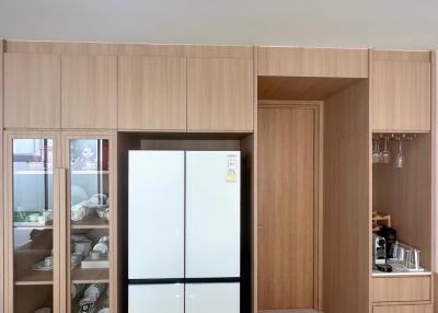 Modern kitchen with built-in wooden cabinets and appliances