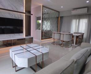 Modern living room interior with marble features and elegant furnishings