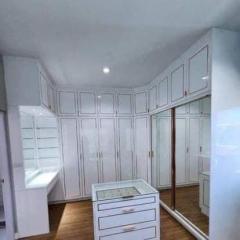 Spacious white kitchen with ample storage