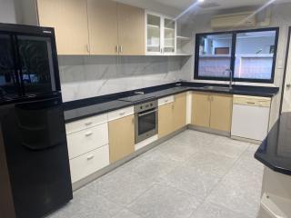 Modern kitchen with built-in appliances and ample counter space