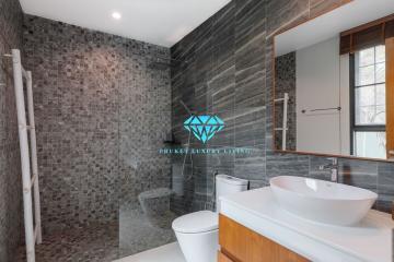 Modern bathroom interior with dark tile finishing