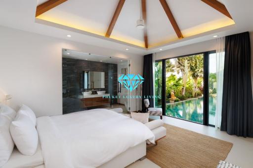 Spacious bedroom with modern design overlooking a lush garden