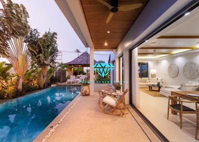 Modern patio and swimming pool area with access to dining space