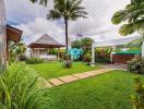 Spacious garden with a gazebo and tropical landscaping