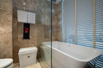 Modern bathroom with a freestanding tub and glass shower stall