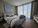 Modern bedroom with large bed and artistic wall decor