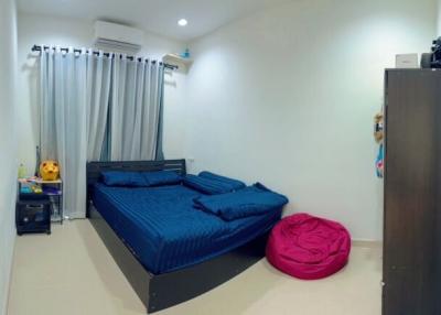 Modern bedroom with king-size bed and air conditioning