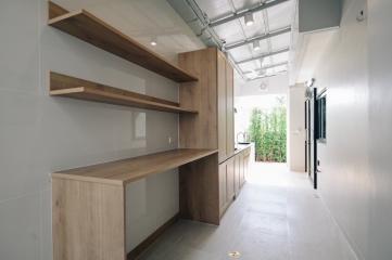 Modern kitchen with wooden cabinets and open shelving