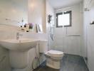 Modern bathroom with clean white fixtures and glass shower