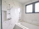 Modern bathroom with marble tiles and bathtub