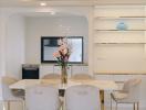 Modern living room with marble dining table and mounted television