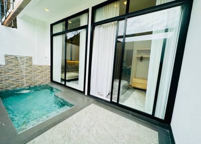 Private outdoor plunge pool with direct access to the master bedroom through sliding glass doors