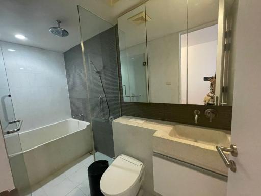 Spacious modern bathroom with bathtub and shower