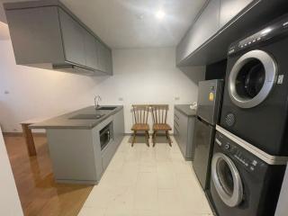 Modern kitchen with built-in appliances and dining area