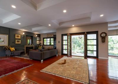 Spacious and elegant living room with natural light and hardwood floors