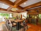 Spacious dining room with hardwood floors and exposed wooden beams