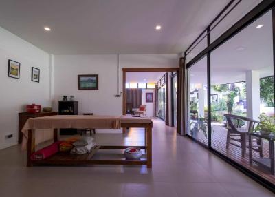 Spacious dining area with large windows and outdoor view