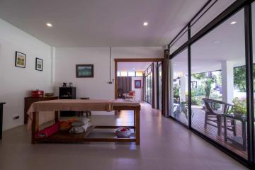 Spacious dining area with large windows and outdoor view