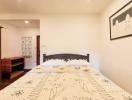 Cozy bedroom interior with double bed and artwork