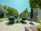 Modern backyard with a swimming pool and lounge chairs