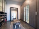 Modern hallway interior with wooden cabinets and stylish seating