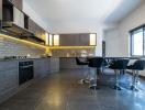 Modern kitchen with bar stools and integrated appliances