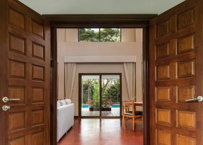 Spacious living room with open doors leading to a patio