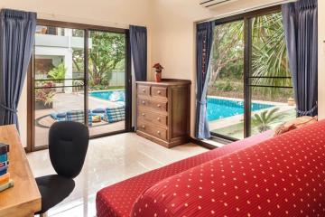 Bright bedroom with direct access to the pool area