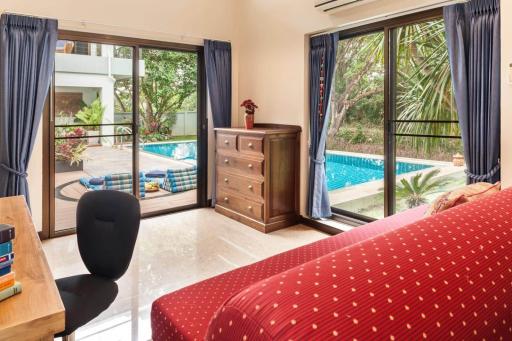 Bright bedroom with direct access to the pool area