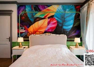 Colorful bedroom with artistic wall design and white bedding