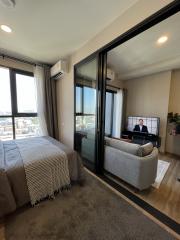 Modern bedroom with attached balcony and living area